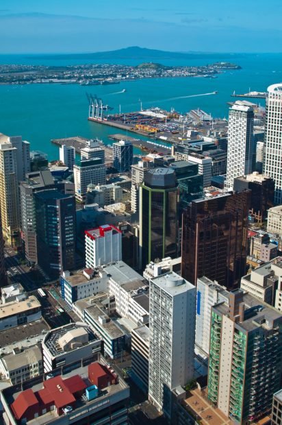 Aerial view over Auckland downtown city with volcano of rangitoto on the horizon, New Zealand